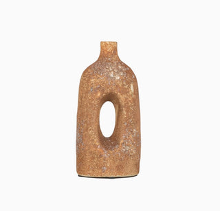 A small rustic ceramic vase with a textured, earthy brown and beige glaze, featuring a central oval cutout and a short neck, set against a plain white background.