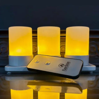 Three glowing Micro Mini Flame Illusion rechargeable LED candles on a white charging base with remote control.