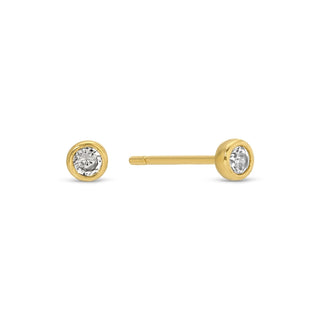 Gold stud earrings with clear gemstones on a white background