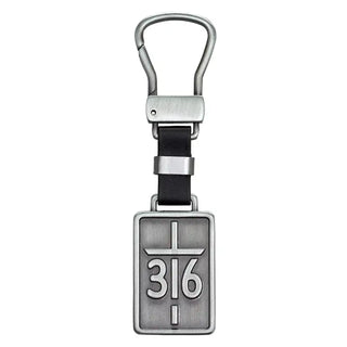 A silver-toned metal keychain featuring a rectangular pendant engraved with a cross and the numbers 316, attached to a black strap and silver carabiner on a plain white background.