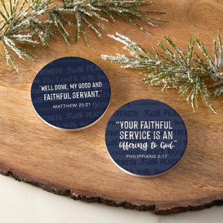 Two navy Scripture ceramic car coasters displayed on a wood surface with frosted greenery.