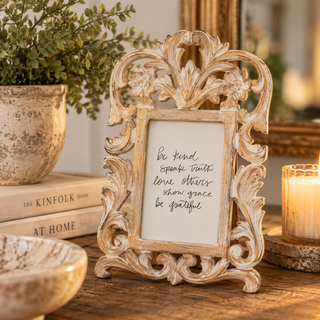 Vintage-inspired 4x6 antique gold filigree picture frame displaying a handwritten “Be Kind, Speak Truth, Love Others, Show Grace, Be Grateful” quote, styled on a rustic wooden table with decorative books, greenery, and a glowing candle.