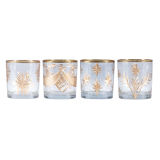 Four glass candle holders with gold accents on a white background