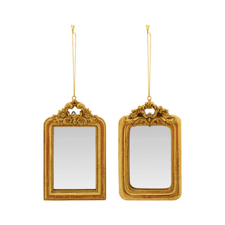 Two gold-framed mirrors hanging against a white background