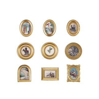Set of decorative wall plates with various designs and gold frames on a white background