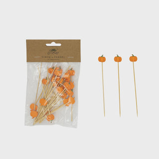 Packaged wooden skewers with pumpkin decorations on a white background